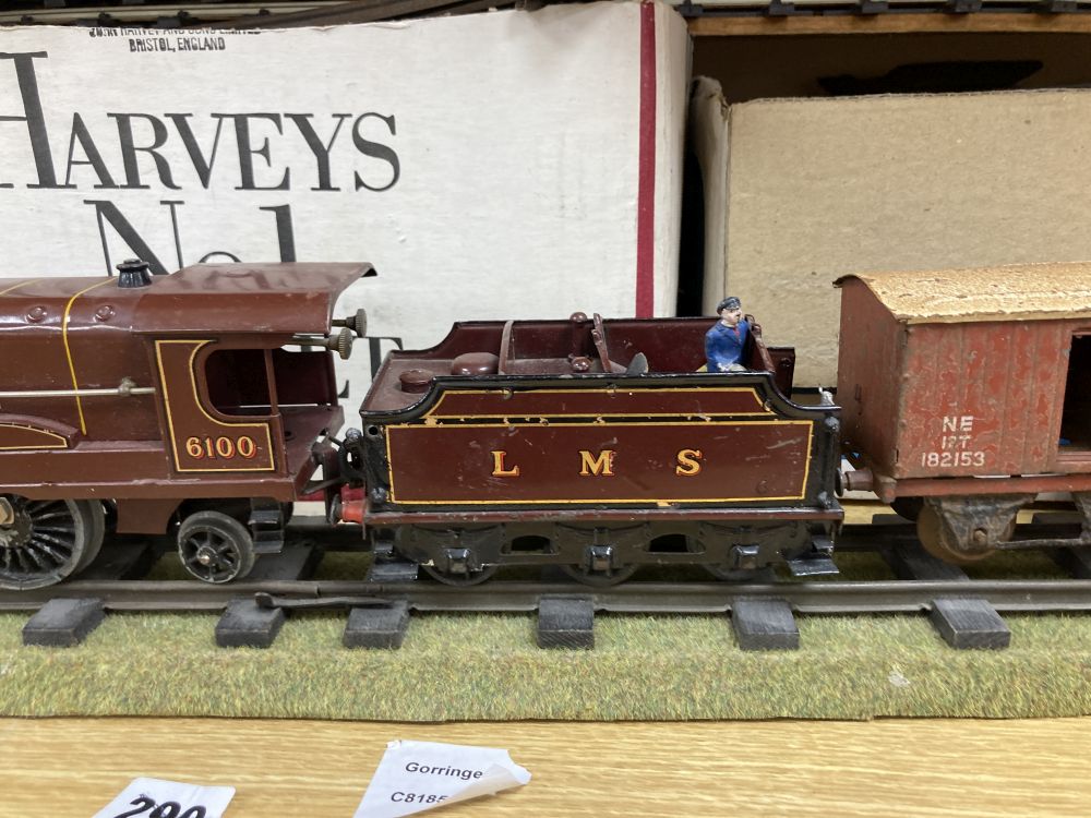 A Hornby O gauge Royal Scot 6100 clockwork locomotive and tender, two no. 31 coaches and a Flat truck, and a quantity of track